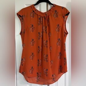 Sleeveless ruffle trim blouse